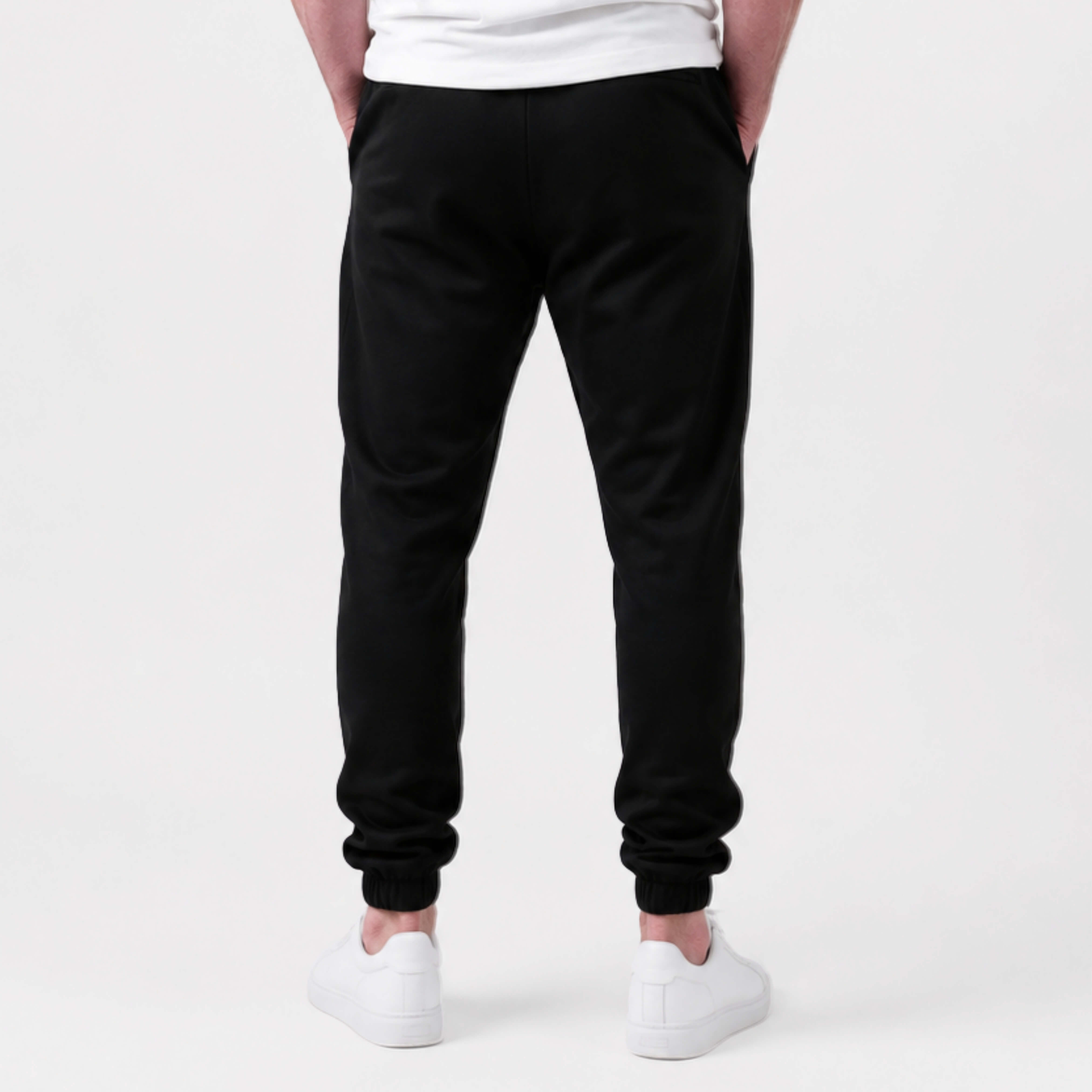 Person wearing  Kovered leakproof  sweatpants on a white background