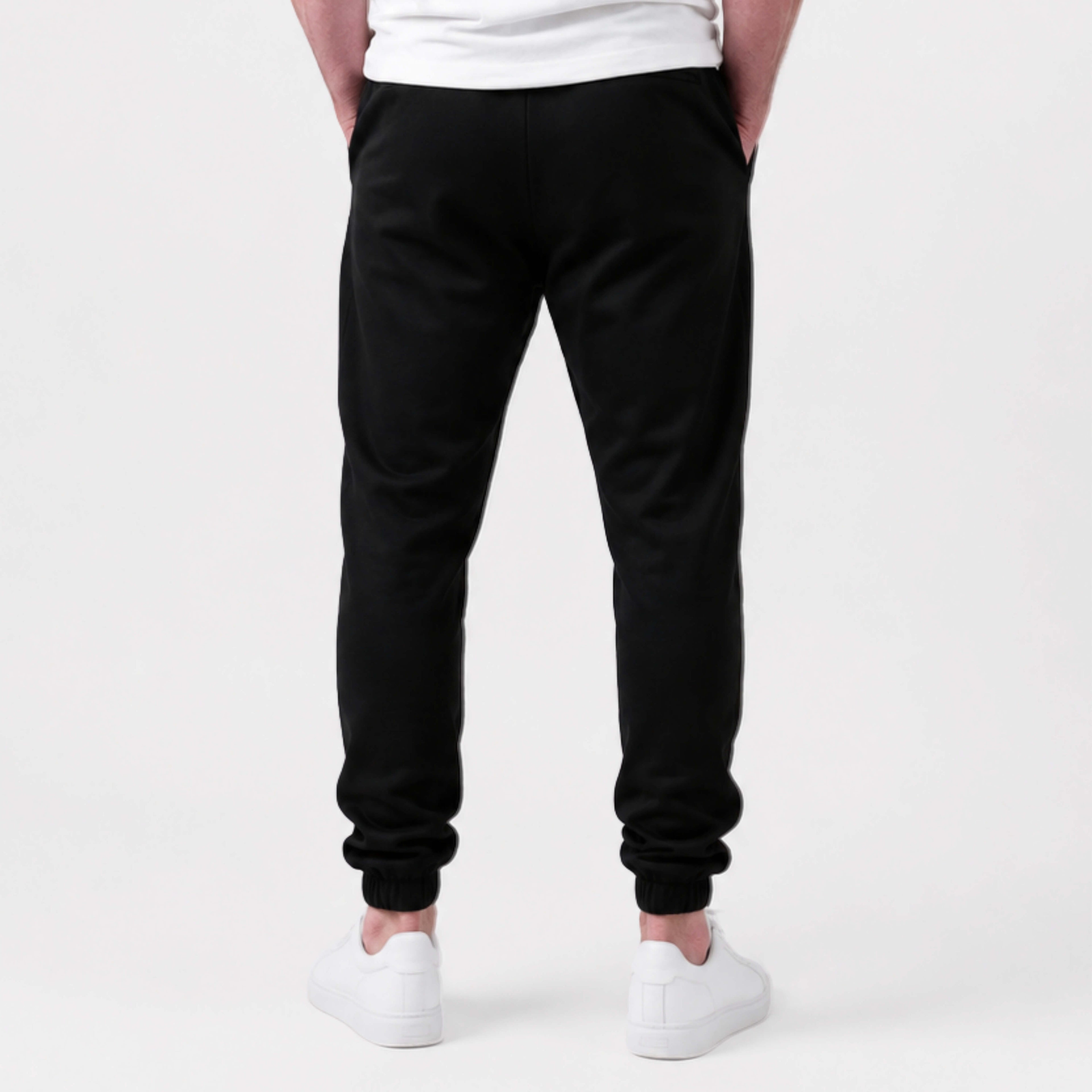 Person wearing  Kovered leakproof  sweatpants on a white background