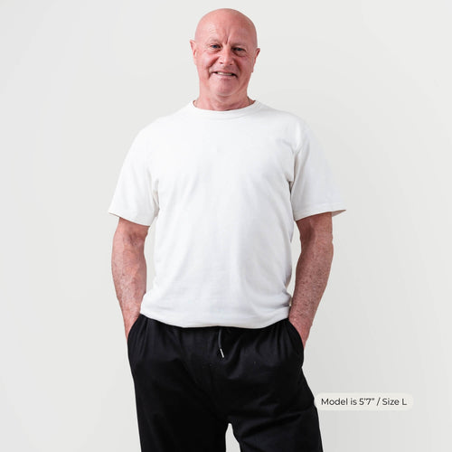 Older man wearing Kovered leakproof trackpants in black — looks like everyday pants, bladder leak protection Australia