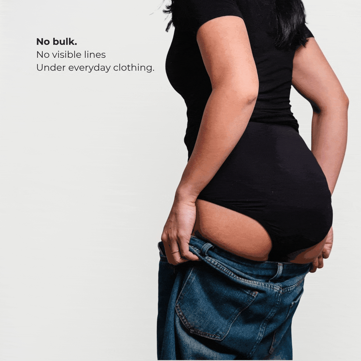 Women's reusable incontinence underwear showing no bulk under clothing - discreet fit